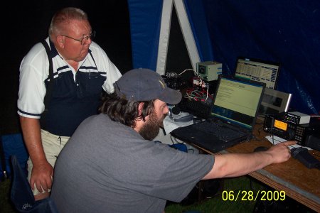 Jerry, KCØWWV operates PSK31 on 40M while Gene, NØWDB, looks on.